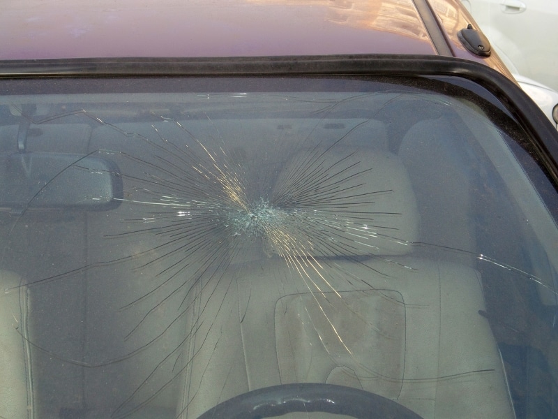 Severely damaged glass showing the result of not repairing cracked windshield early