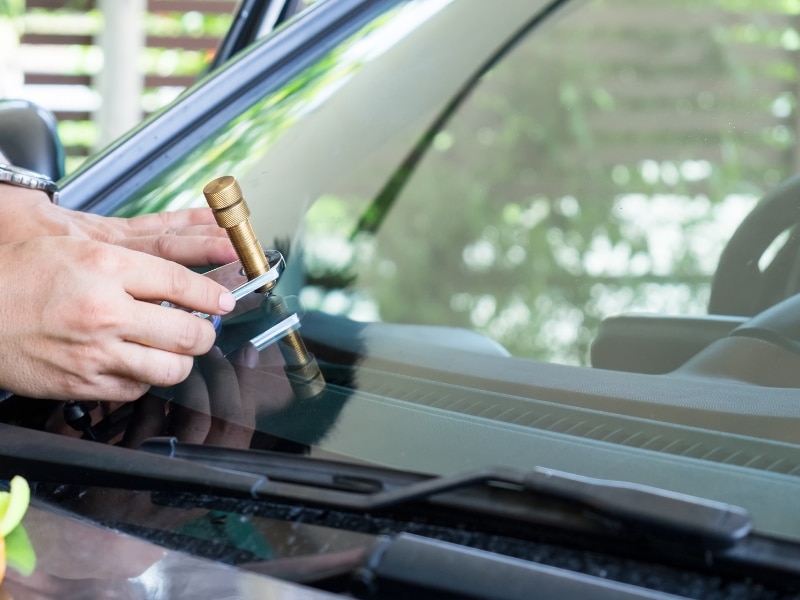Windshield repair tool showing how much does it cost to fix a car window